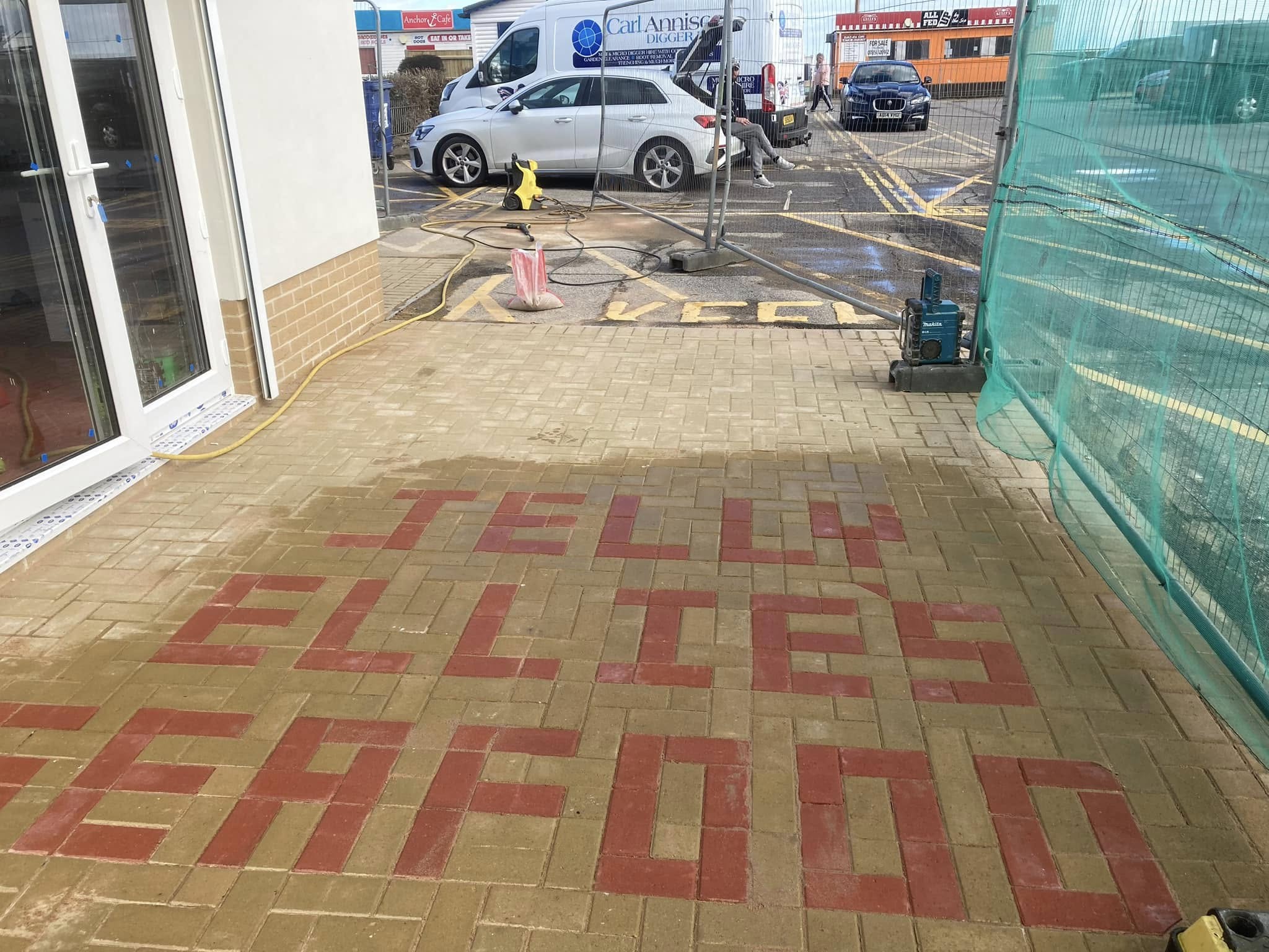 Newly paved forecourt for Jelly Ellie's Seafood shop in Great Yarmouth using grey block paving.